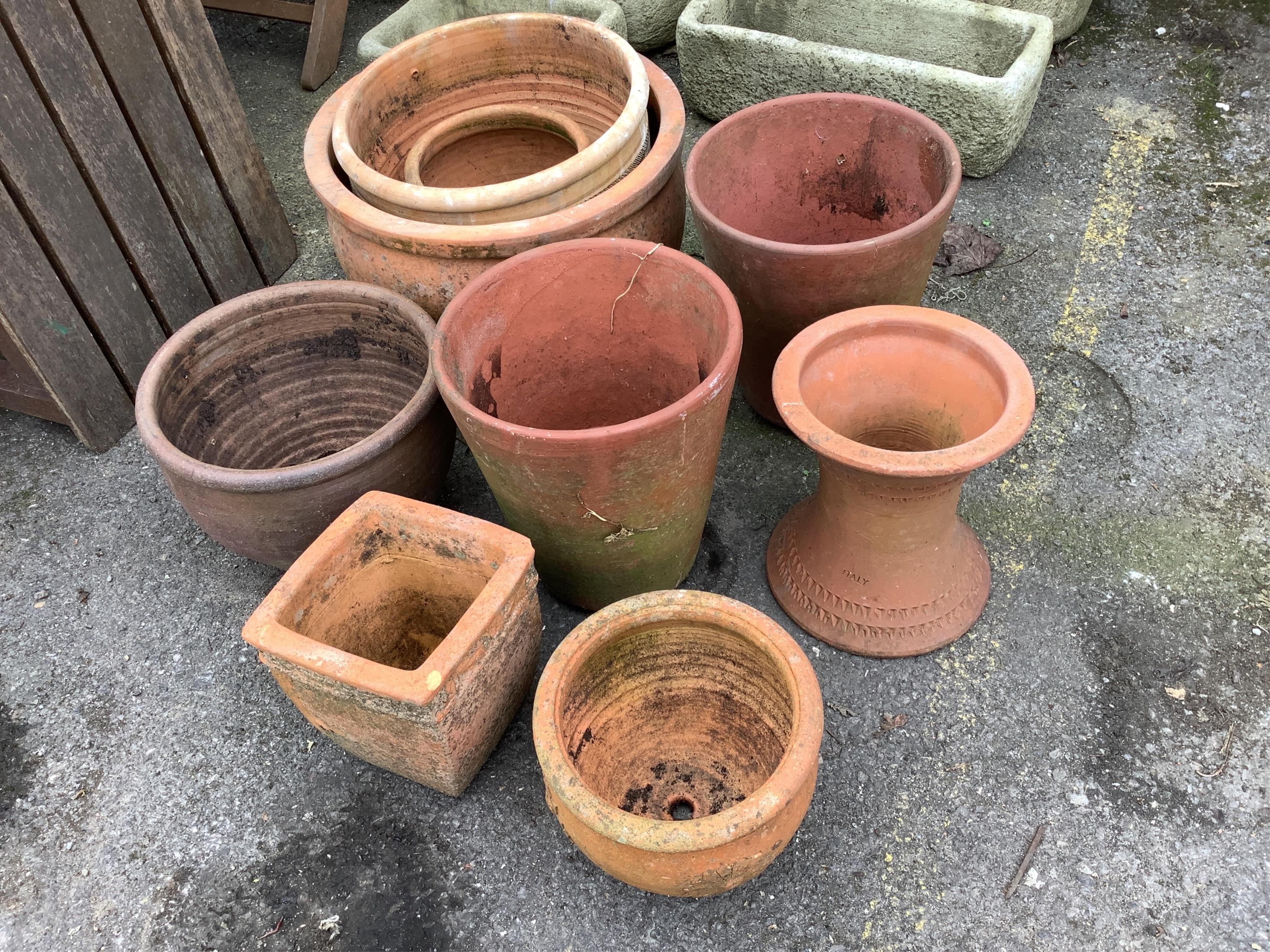 Nine assorted terracotta garden planters, largest diameter 46cm, height 30cm